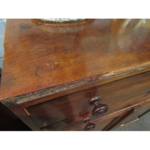 1054 - An early Victorian mahogany cabinet, the two drawers over two cupboard doors, bracket supports, some... 