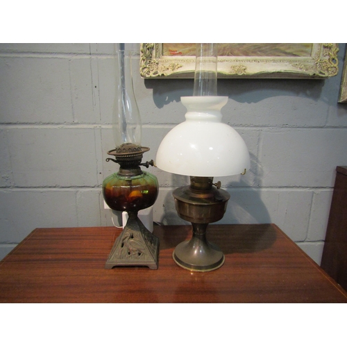 1056 - Two oil lamps, one with brass base