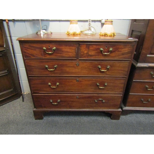 1066 - A George III mahogany chest of two short over three long drawers, brass swan neck handles, on bracke... 