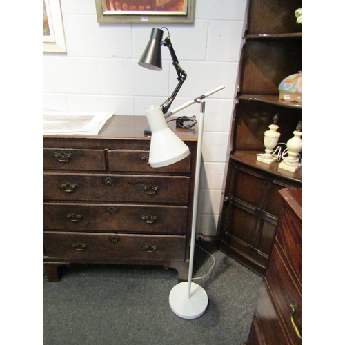 1071 - A white floor standing reading lamp and a black adjustable table lamp