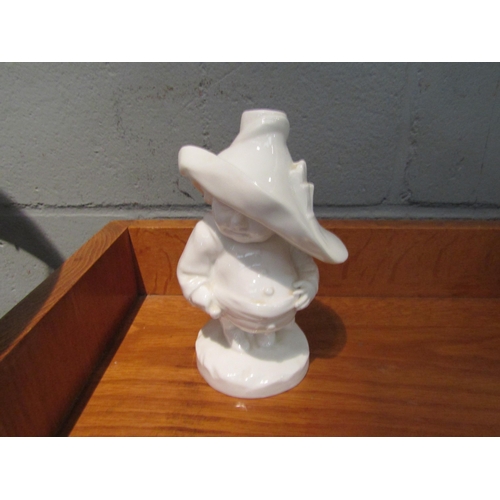 1087 - A Crown Derby cream glazed manson house dwarf figure a/f, damage to hat, 16cm high         (E) £20-3... 