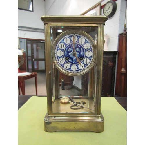 1170 - A brass four-glass mantel clock, beveled glass panels, French movement with logo for Victor Reclus, ... 