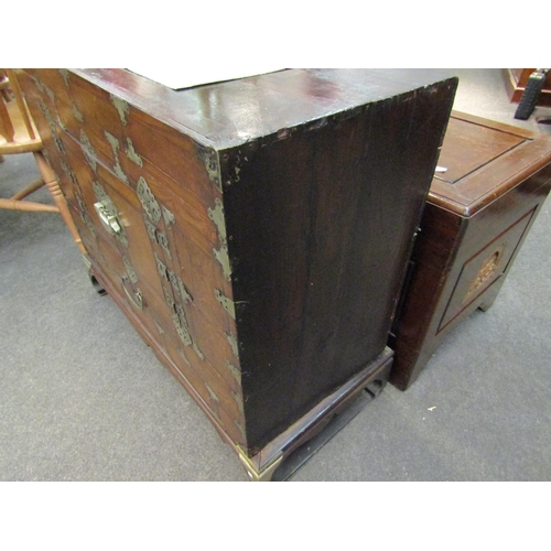 1171 - A Korean wooden cabinet with veneered front, two front doors, metal trims, on matching stand, 78cm h... 