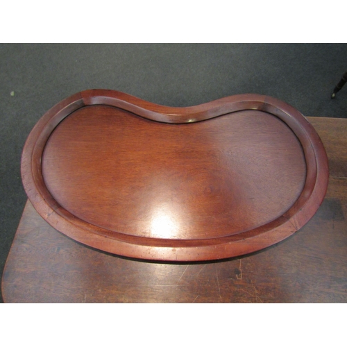 1176 - An early 20th Century mahogany kidney shaped drinks tray, 74cm long   (R) £40