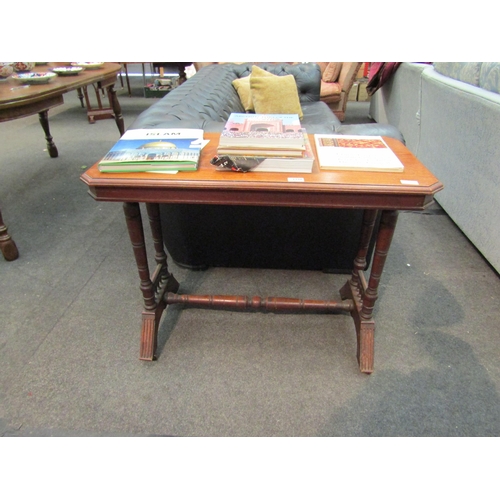 1186 - A late Victorian walnut side table, the canted corner top over ring-turned supports to spindle rails... 