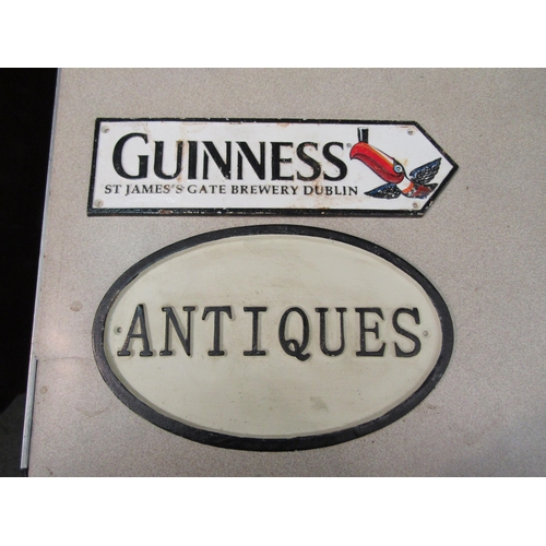 1197 - A reproduction Guinness street sign, 37cm long, and a cast iron 