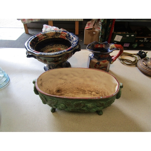 1200 - A Mason's Ironstone twin handled jardiniere and jug and a leaf form Holkham Pottery planter (3)