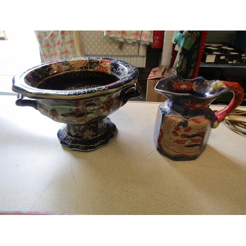 1200 - A Mason's Ironstone twin handled jardiniere and jug and a leaf form Holkham Pottery planter (3)