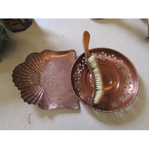 1202 - Two early 20th Century copper trays, one pierced with leaf design, plus a copper covered wooden crum... 