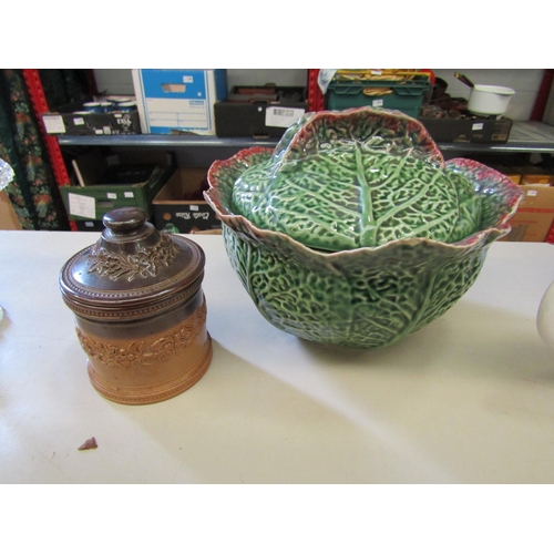 1208 - A Portuguese cabbage leaf lidded pot, some chips. A Doulton Lambeth tobacco pot (2)   (R) £0