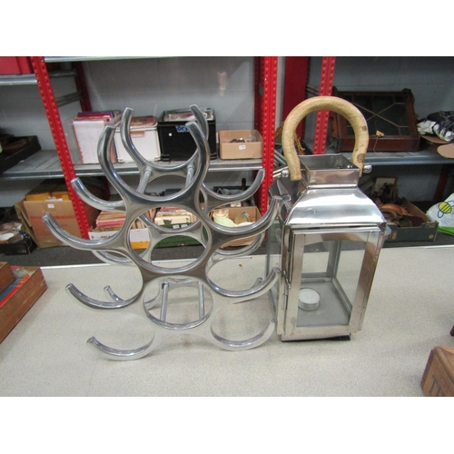 1219 - A chrome lantern and wine rack