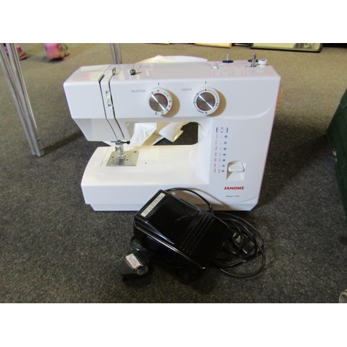 1223 - A Janome electric sewing machine model 1560 with instruction booklet