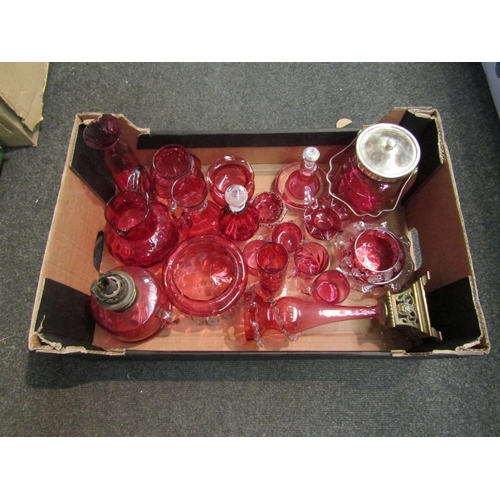 1259 - A large selection of ruby and cranberry glassware including a Dartington scent bottle, oil lamp etc