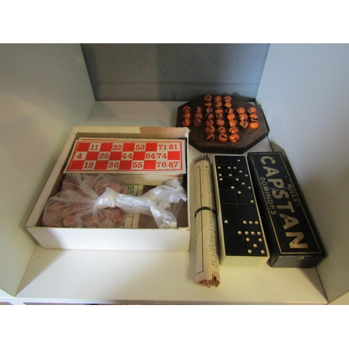 1280 - A solitaire game, a vintage lotto game and pick up sticks and two sets of vintage dominoes