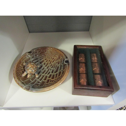 1304 - A boxed set of 1930's copper plated napkin rings depicting deer and a Wade tortoise ashtray