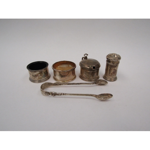 1335 - A selection of silver items including a pair of tongs, mustard, salt and pepperette etc