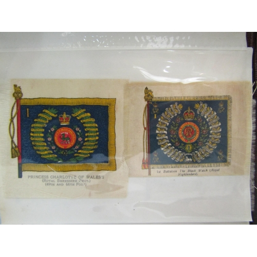 1380 - An album containing 30 regimental badges and flags printed on silk