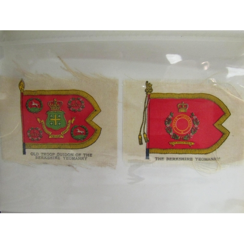 1380 - An album containing 30 regimental badges and flags printed on silk