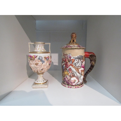 1406 - Two pieces of Capodimonte: a highly decorated cup and cover with lion finial and elephant handle and... 