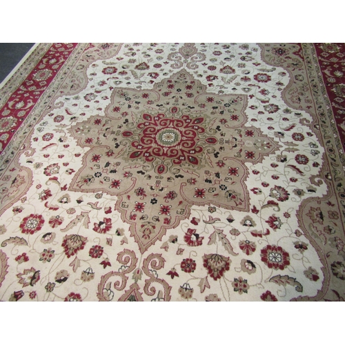 1576 - A Turkish wool rug in cream and red tones, classical design, 2.8 metres x 3.8 metres