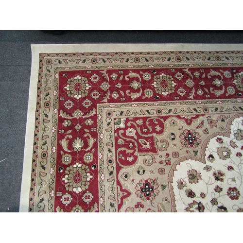 1576 - A Turkish wool rug in cream and red tones, classical design, 2.8 metres x 3.8 metres