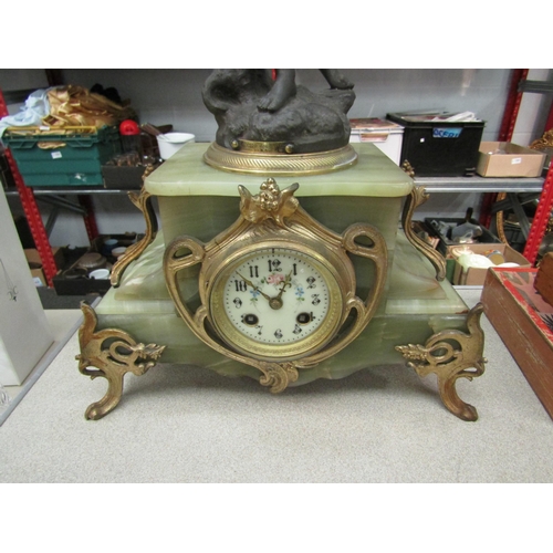 1214 - An onyx and brass French clock ca. 1880, spring driven movement signed Japy et Cie, striking on bell... 