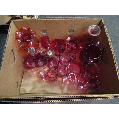 1243 - A large selection of ruby and cranberry glassware including decanter, glasses, vases etc