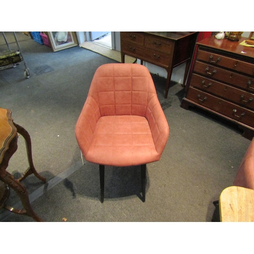 1080 - A set of four peach coloured modern tub chairs with tubular legs    (R) £60