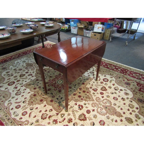 1182 - A Victorian mahogany Pembroke table with single drawer on tapering legs to castors   (R) £20