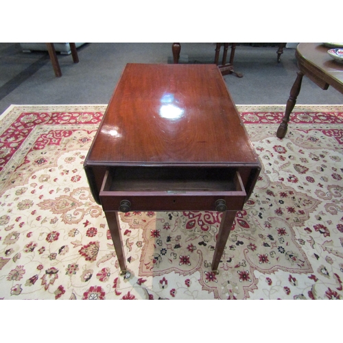 1182 - A Victorian mahogany Pembroke table with single drawer on tapering legs to castors   (R) £20