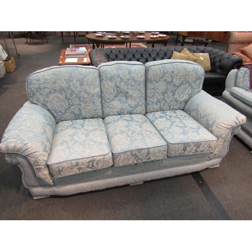 1187 - A classic style three-seater sofa, rope trim, loose cushions, pale blue floral upholstery, Life Styl... 