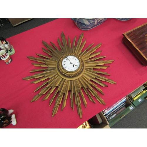 1550 - A sunburst wall clock, a/f