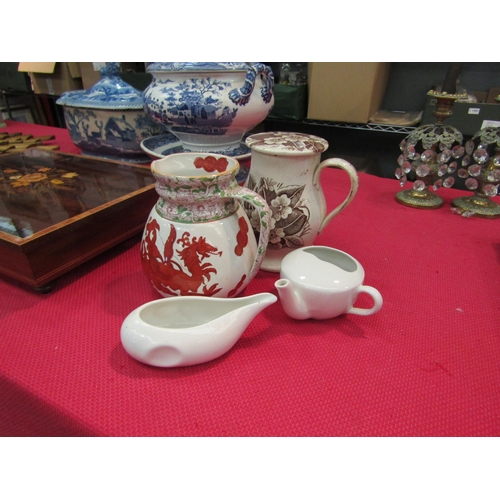 1555 - A Staffordshire lidded treacle mug, a Mason's Ironstone red dragon jug, a white pap boat and white f... 