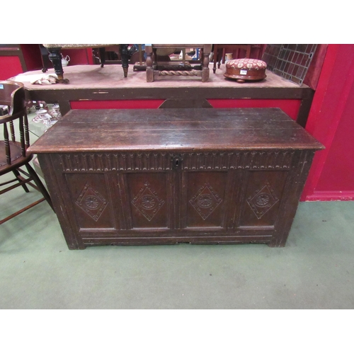 4018 - A late 18th Century four panel carved oak coffer, 63cm high x 130cm wide x 57cm deep