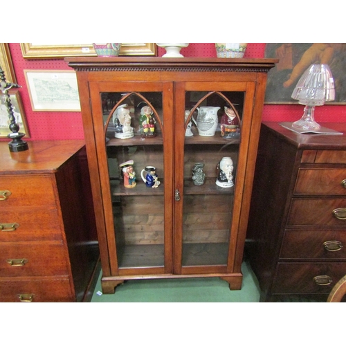 4040 - A Victorian mahogany arched glazed two door bookcase with working lock and key the height adjustable... 