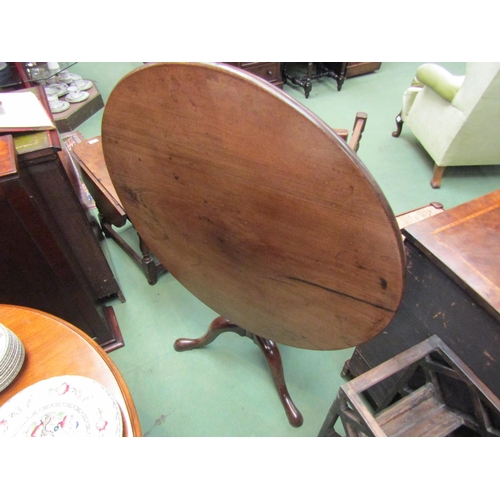 4080 - Circa 1780 a mahogany circular tilt top wine table on baluster turned column on pad foot tripod base... 