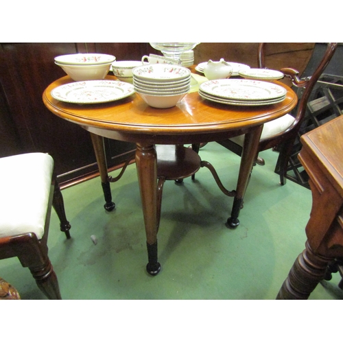 4078 - A satin walnut Biedermeier circular top table over turned and tapering legs on carved ebonised feet ... 