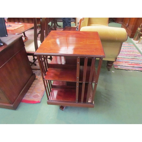 4082 - An Edwardian mahogany and satin walnut crossbanded revolving bookcase, 83cm high  (R)   £200