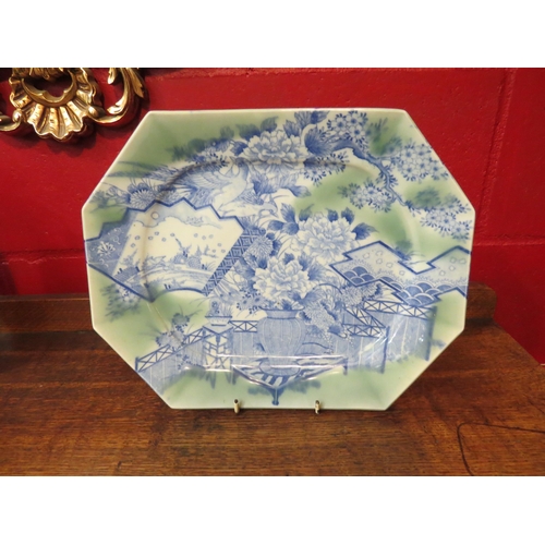 4127 - An Oriental blue and white meat platter with green tint, decorated with vase of flowers and birds in... 