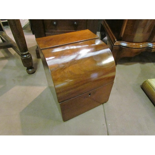 4136 - A 19th Century flame mahogany dome top box the hinged lid opening to reveal a velvet lined interior,... 