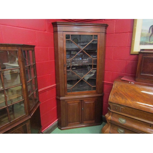 4179 - A mahogany full height corner cabinet with glazed panelled door over cupboard doors, working locks a... 