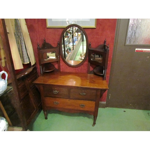 4155 - Circa 1890 an Arts & Crafts walnut dressing chest, the finial raised back with central oval mirror a... 