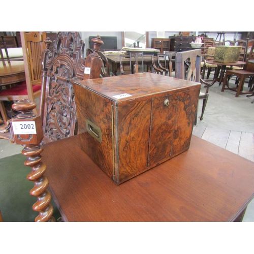 4096 - A Victorian burr walnut campaign cigar or jewellery box with two drawers, behind two lockable doors,... 