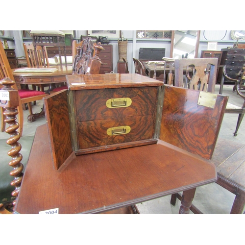 4096 - A Victorian burr walnut campaign cigar or jewellery box with two drawers, behind two lockable doors,... 