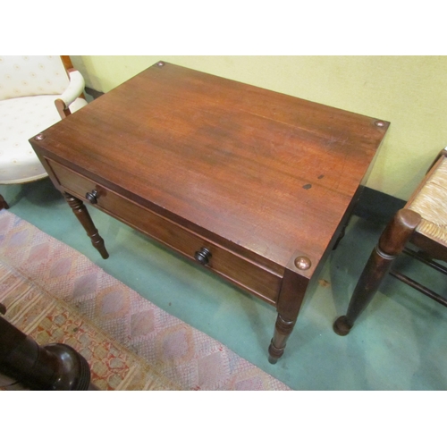 4198 - A 19th Century mahogany lamp table with metal stud corner decoration over a single frieze drawer on ... 