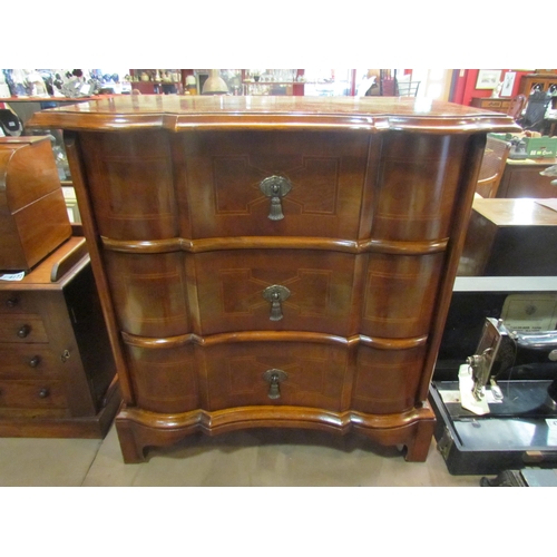 4223 - An early 19th Century style crossbanded walnut chest of small proportions the three drawers over bra... 