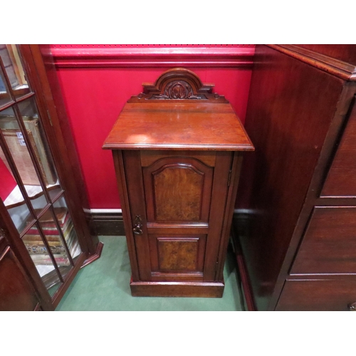 4237 - A late Victorian carved raised back walnut and burr walnut bedside cabinet the single door over a pl... 