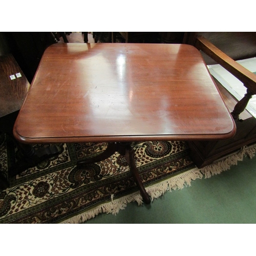 4074 - Circa 1830 a mahogany tilt top wine table over a turned baluster column and outswept tripod base on ... 