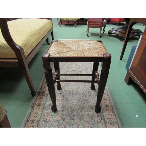 4191 - An 18th Century style oak stool the rush seat over straight cabriole legs on ball feet joined by str... 