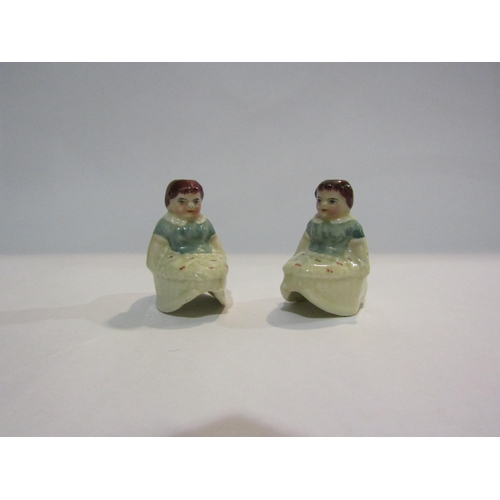 4333 - A pair of rocking girl miniature porcelain tapersticks, 5cm tall